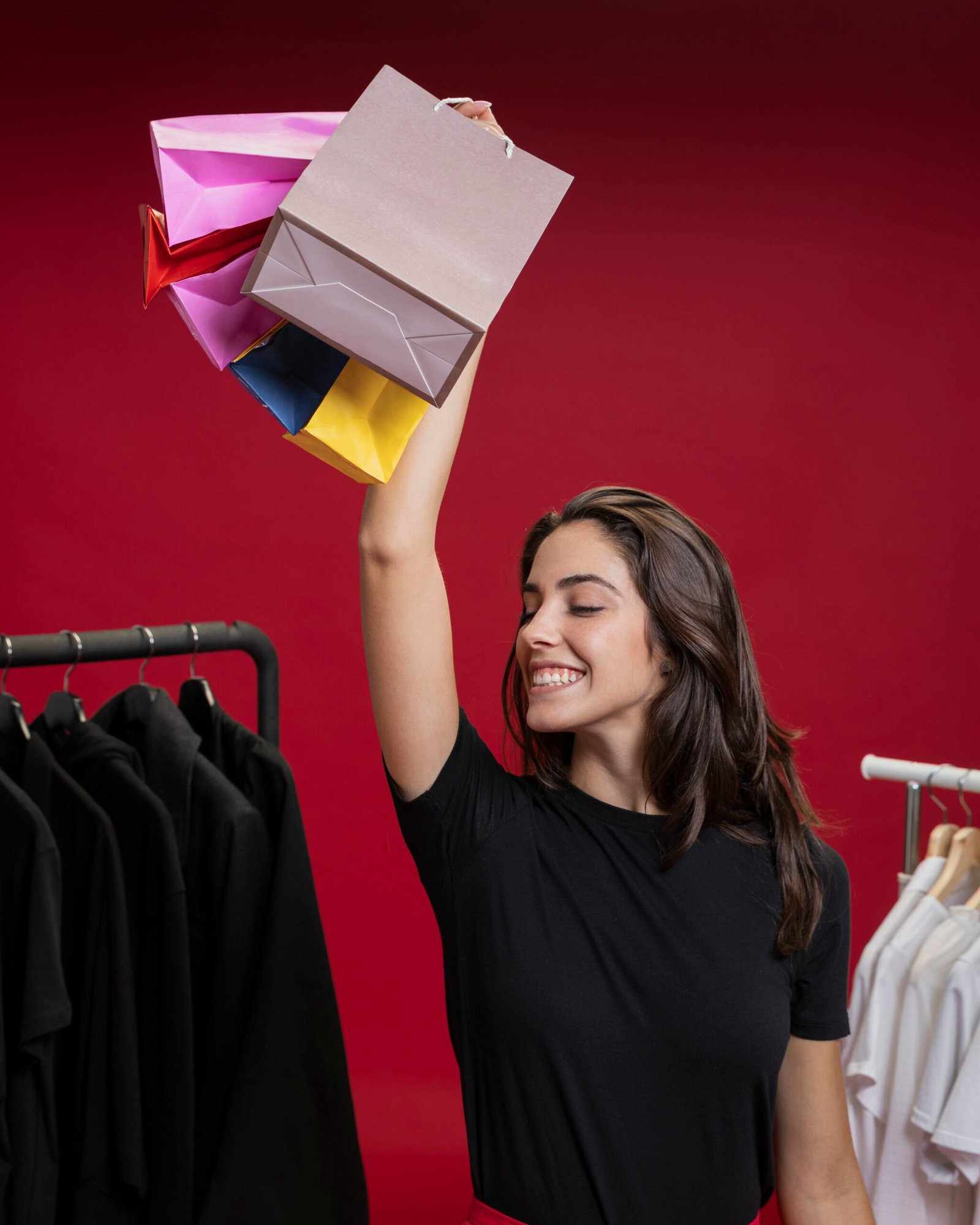smiley-woman-holding-up-her-shopping-bags